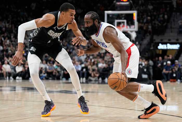 Los Angeles Clippers guard James Harden (1) drives to the basket against San Antonio Spurs forward Victor Wembanyama (1) during the first half at Frost Bank Center.